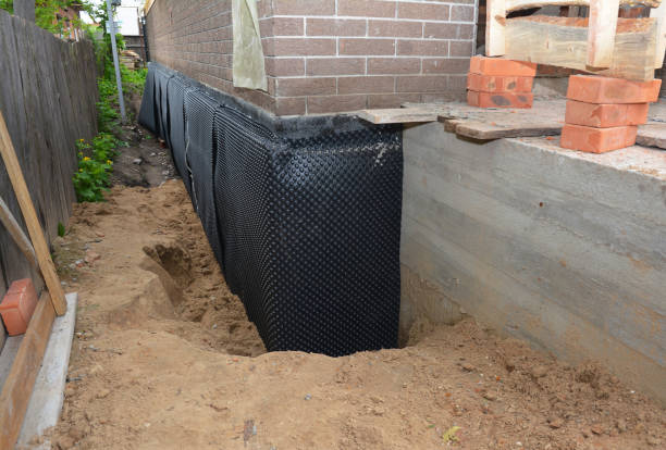 SJ Waterproofing Pros technician performing targeted Wet Basement Repair assessment in Sparta, GA